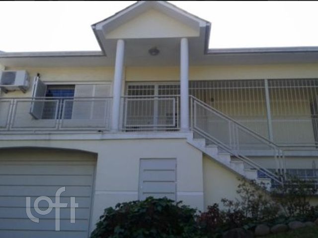 Casa com 510m², 3 dormitórios, 3 suítes, 6 vagas, Três Figueiras em Porto Alegre