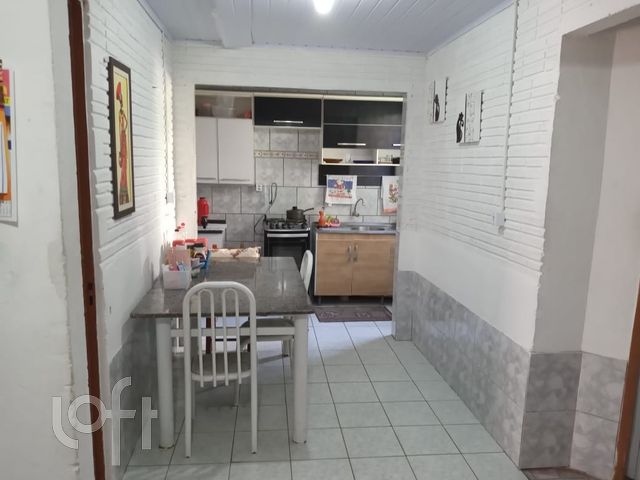 Casa com 32m², 3 dormitórios no bairro Guajuviras em Canoas para Comprar