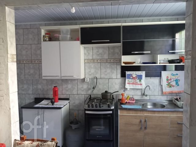 Casa com 32m², 3 dormitórios no bairro Guajuviras em Canoas para Comprar