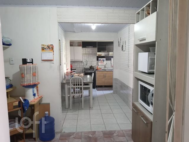 Casa com 32m², 3 dormitórios no bairro Guajuviras em Canoas para Comprar