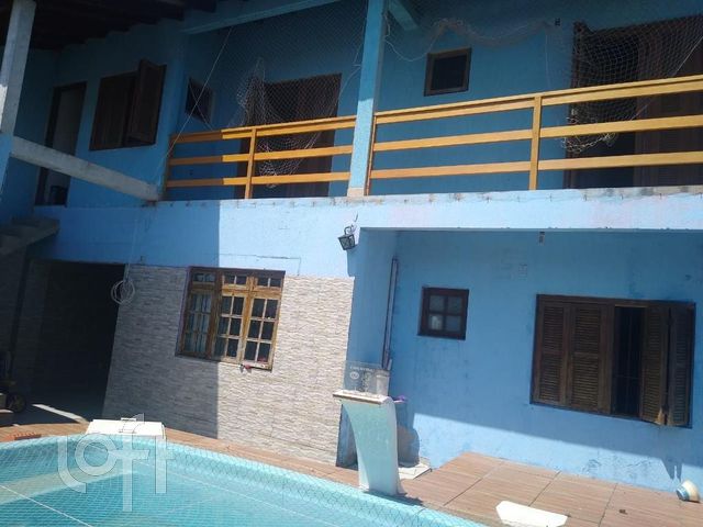 Casa com 260m², 4 dormitórios, 1 suíte, 7 vagas no bairro Rio Branco em Canoas para Comprar