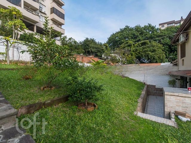 Casa com 290m², 3 dormitórios, 1 suíte, 2 vagas, Cristo Redentor em Porto Alegre