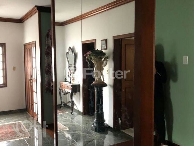 Casa com 345m², 3 dormitórios, 1 suíte, 4 vagas, Chácara das Pedras em Porto Alegre