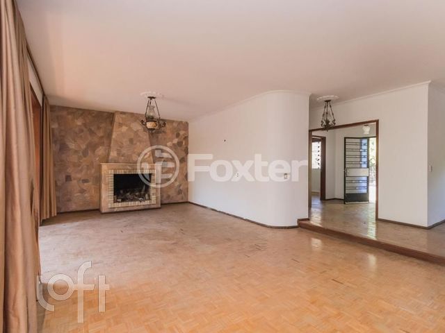 Casa com 502m², 4 dormitórios, 1 suíte, 5 vagas, Chácara das Pedras em Porto Alegre
