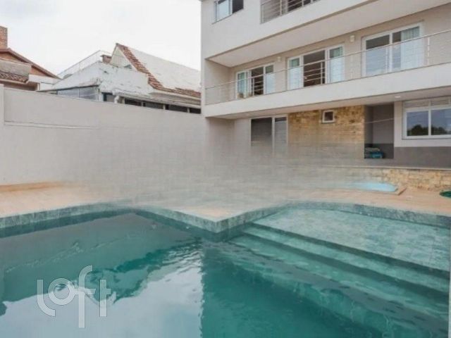 Casa com 447m², 4 dormitórios, 3 suítes, 4 vagas, Chácara das Pedras em Porto Alegre